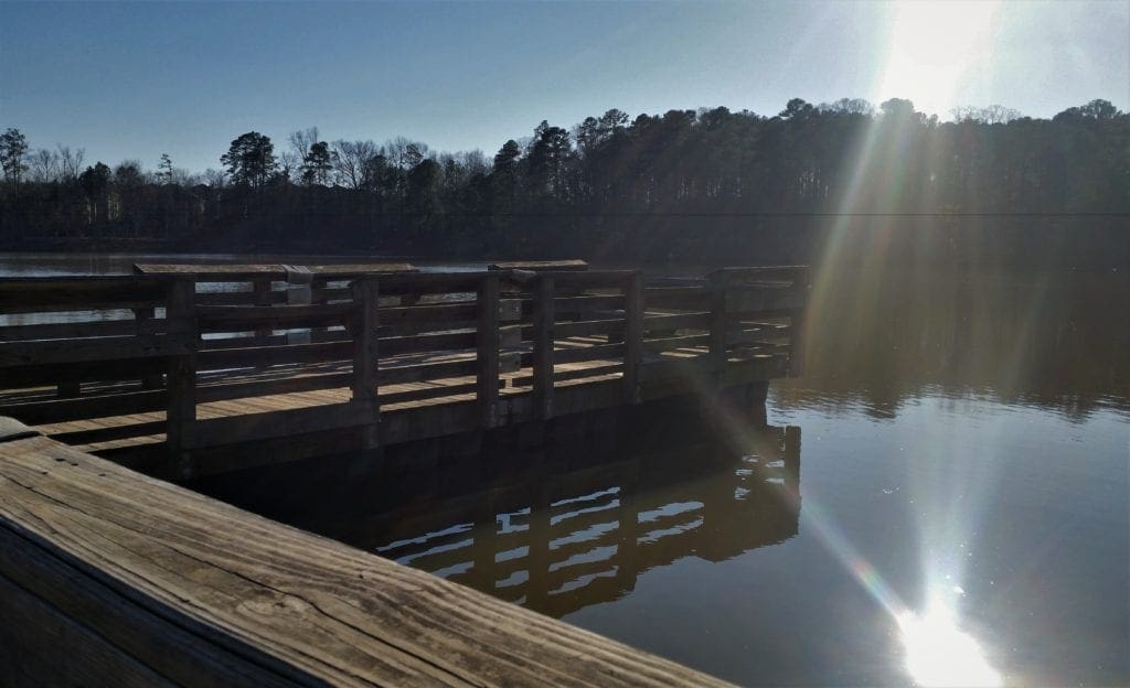 The Lake Pine Trail is a 2 mile paved loop that circles 50-acre Lake Pine in Apex Community Park, located near the dividing line between the towns of Cary and Apex, North Carolina. Lake Pine is a great trail for running or walking, is smooth and wide enough to use your stroller or baby jogger, too - and is good for all skill levels. The trail runs between the lake and other natural areas, so even though you're in the middle of town, there's a good chance to see wildlife.