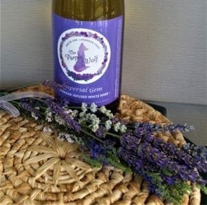 Wine with cut lavender stems.