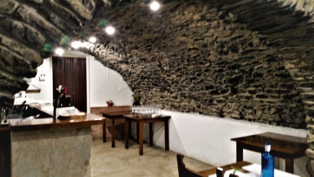 The Casa Ruben restaurant dining room sits under an arch built in 1593
