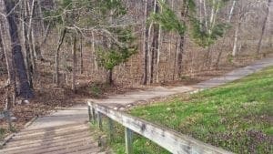 Steps from the dam down to the White Oak Creek Trail