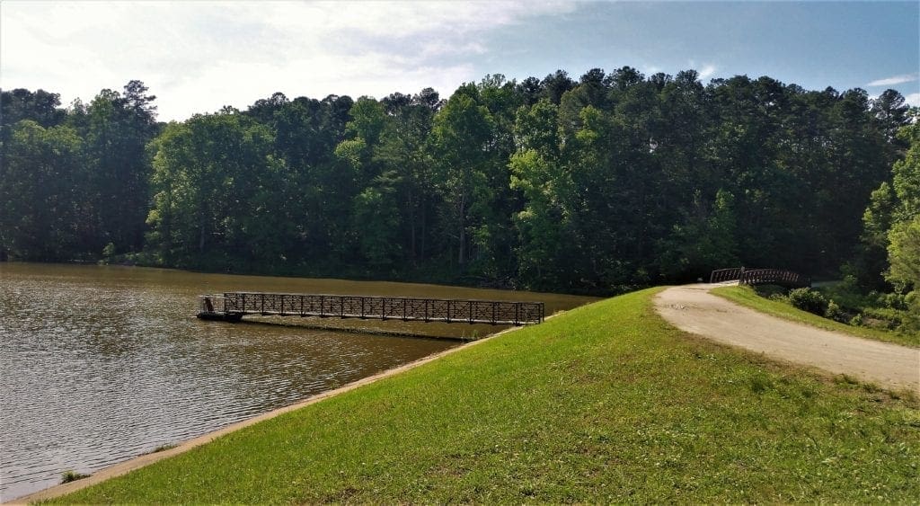 Reedy Creek Lake and multi-use trail on a sunny day.