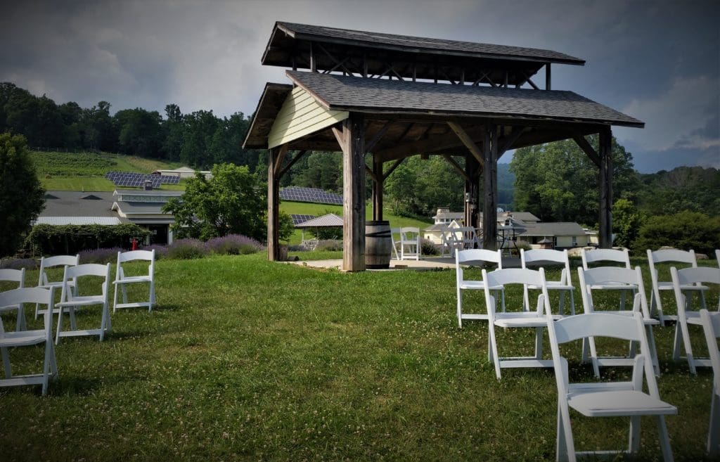 Walking up the aisle in the outdoor wedding venue.
