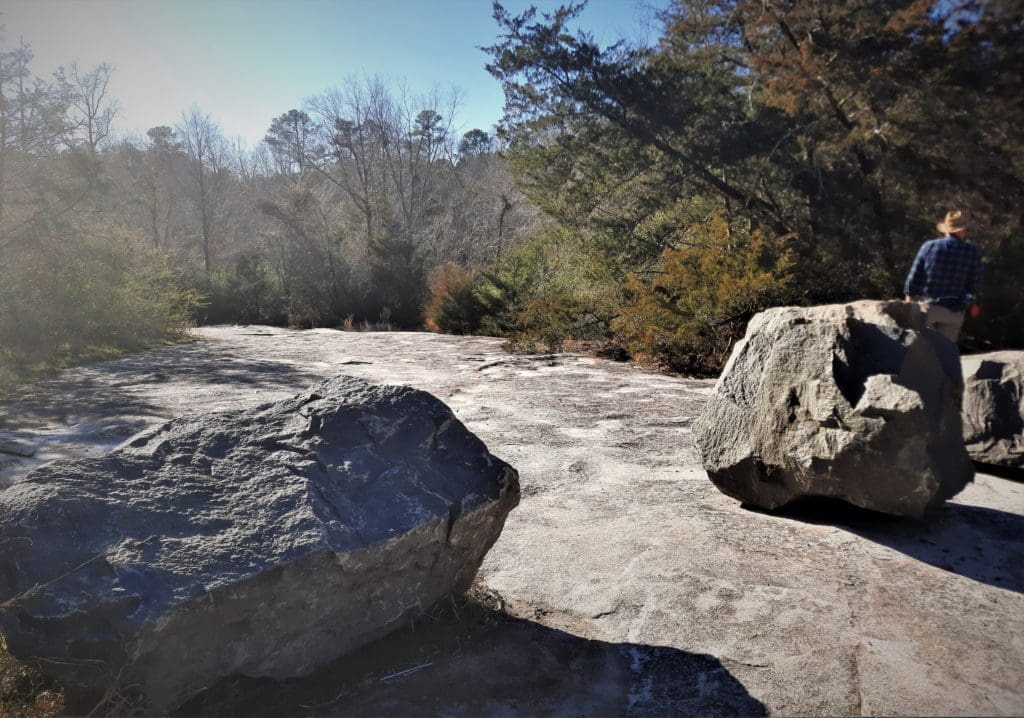 You'll see three large boulders on your way in on the Pulleytown side.