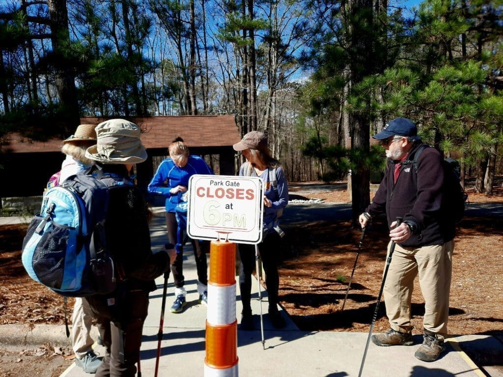 Gathering at the trailhead for a sunny Monday hike.